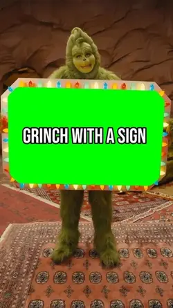 Grinch Holding sign