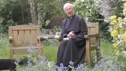 Cat Under Priest
