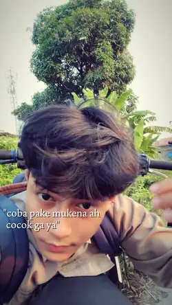 coba pake mukena ah