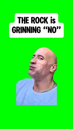THE ROCK GRINNING
