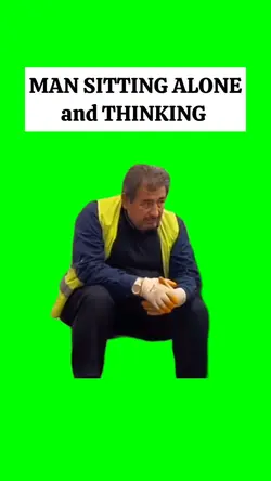 MAN SITTING ALONE